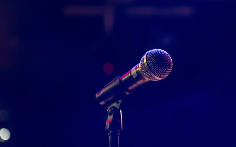 black and gray microphone on black stand
